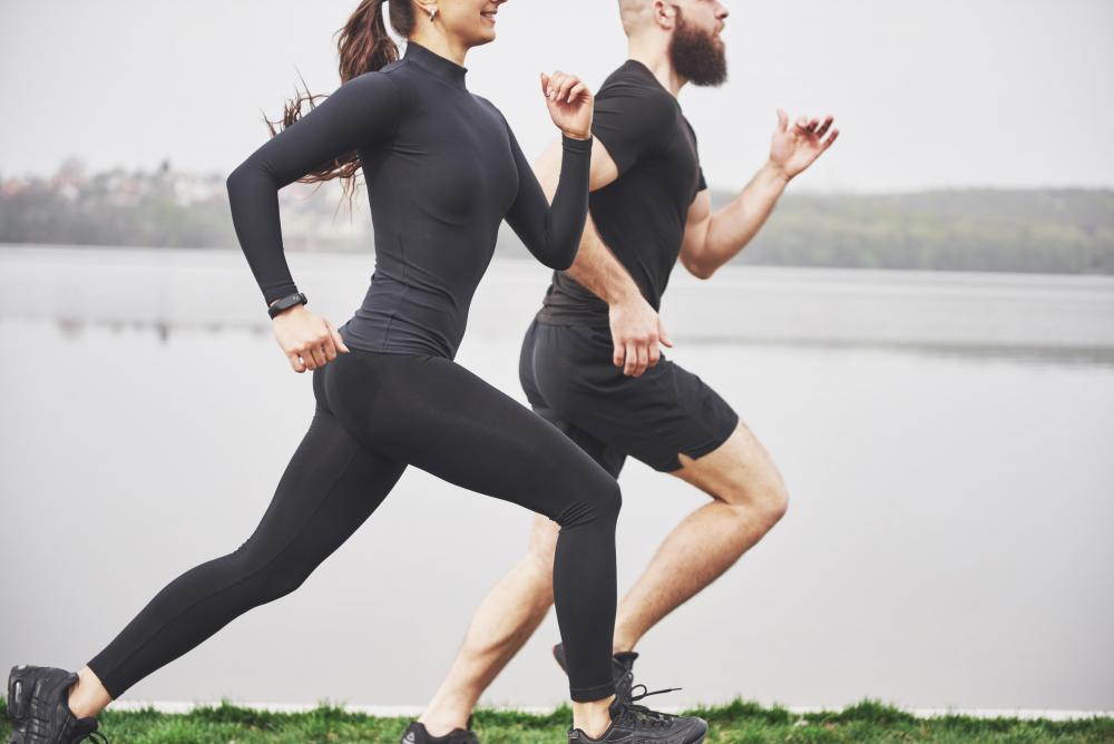 couple-jogging-running-outdoors-park-near-water-young-bearded-man-woman-exercising-together-morning.jpg